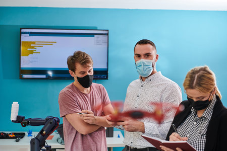 A group of students working together in a laboratory, dedicated to exploring the aerodynamic...