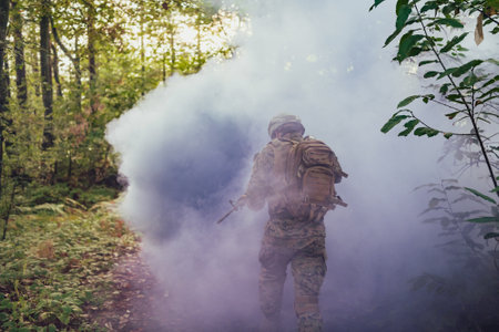 Battle of the military in the war. Military troops in the smokeの写真素材