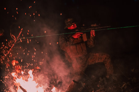 Soldiers squad in action on night mission using laser sight beam lights military team conceptの写真素材