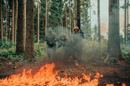 Modern warfare soldiers surrounded by fire fight in dense and dangerous forest areasの写真素材
