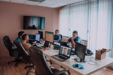 Programmers engrossed in deep collaboration, diligently working together to solve complex problems...