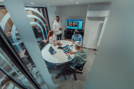 A diverse group of businessmen collaborates and tests a new virtual reality technology, wearing...