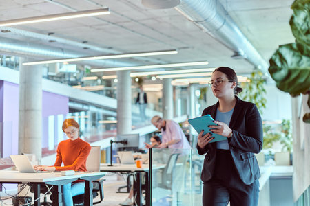 In the modern corporate world, a diverse group of businesspeople, representing various backgrounds...