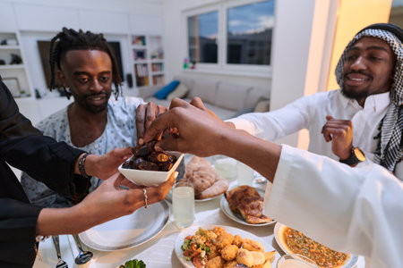 In a poignant close-up, the diverse hands of a Muslim family delicately grasp fresh dates, symbolizing the breaking of the fast during the holy month of Ramadan, capturing a moment of cultural unity, shared tradition, and the joyous anticipation of communal iftarの写真素材