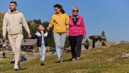 A family shares delightful moments with their friends amid the stunning landscapes of mountains,...