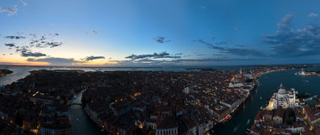 Venice panoramic cityscape landmark at sunset or night, aerial view of Piazza San Marcoの写真素材