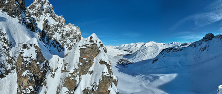 Winter drone shot of ski pistes and slopes covered with fresh powder snow in Tignes in Valdisere...