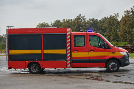 A state-of-the-art firetruck, equipped with advanced rescue technology, stands ready with its...