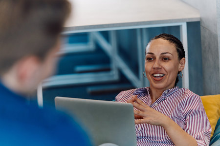 A modern programmer discussing future business projects with colleagues in a modern startup office