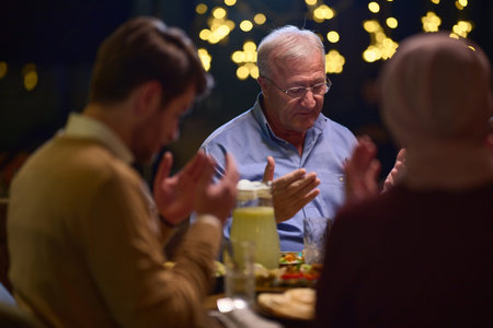 In a modern restaurant setting, a European Islamic family comes together for iftar during Ramadan,...