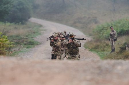 A disciplined and specialized military unit, donned in camouflage, strategically patrolling and...