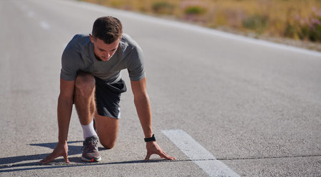 Determined Stride: Athletic Man Embarks on Marathon Preparation with Resolve.