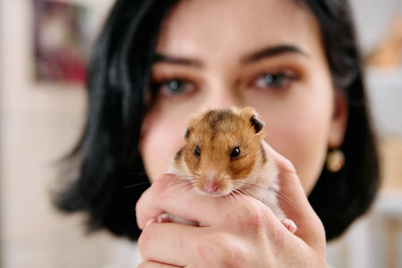 A Black-Haired Beauty Enjoys a Cozy Day at Home with Her Pet Mouseの写真素材