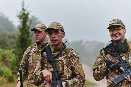 A disciplined and specialized military unit, donned in camouflage, strategically patrolling and maintaining control in a high-stakes environment, showcasing their precision, unity, and readiness for special operationsの写真素材