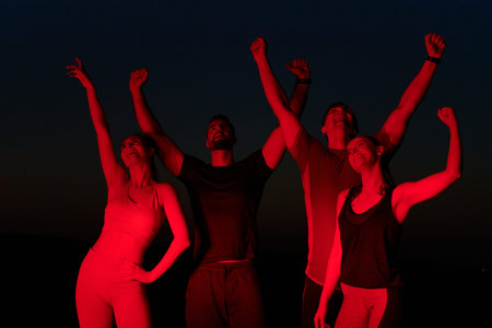 Late-Night Triumph: Group of Friends Celebrate Marathon Success.