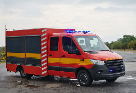 A state-of-the-art firetruck, equipped with advanced rescue technology, stands ready with its skilled firefighting team, prepared to intervene and respond rapidly to emergencies, ensuring the safety and protection of the communityの写真素材