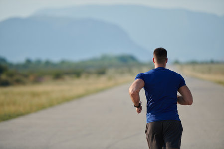 Determined Stride: Athletic Man Embarks on Marathon Preparation with Resolve.の写真素材
