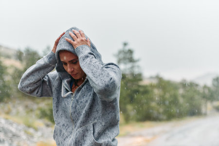 Woman Resting in the Rain After Intense Runの写真素材