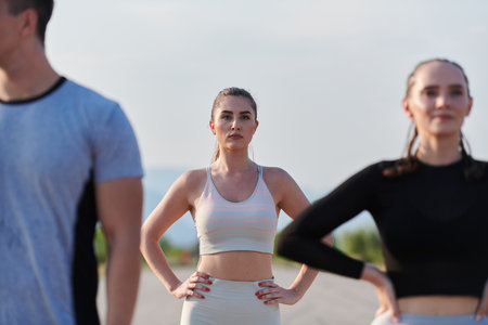 Diverse Athletic Warm-Up: Group Prepares for Intense Running Challenge.の写真素材