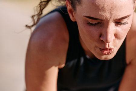 Woman Resting After Intense Runの写真素材