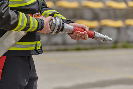 Professional Firefighter Training with Water Hose