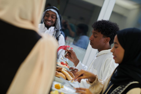 A traditional and diverse Muslim family comes together to share a delicious iftar meal during the sacred month of Ramadan, embodying the essence of familial joy, cultural richness, and spiritual unity in their shared celebrationの写真素材