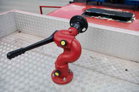 Close-up of essential firefighting equipment on a modern firetruck, showcasing tools and gear ready...