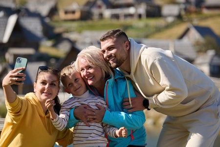Radiant with joy, a happy family captures precious moments in nature as they share smiles and...