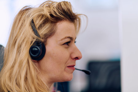 Friendly Call Center Agent Answering Incoming Calls with Headset Providing Remote Customer Service.