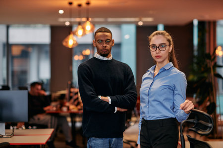 Digital Collaboration: Blonde Businesswoman and African American Partner Reviewing Documents Online