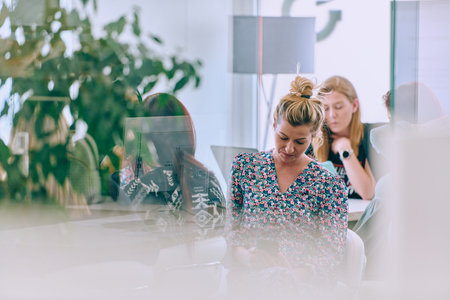 Business Team of Women Discussing New Topics and Strategies to Improve Client Operations.