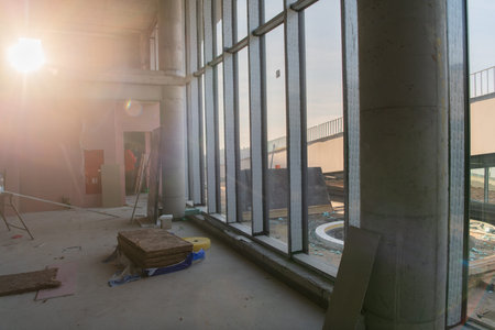 A captivating view of a modern business building under construction, showcasing its raw industrial...