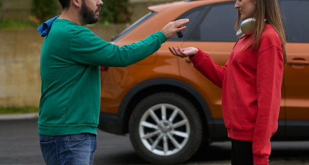 Car keys handshake, seller or car salesman and customer in a dealership, shake hands over the car keysの写真素材