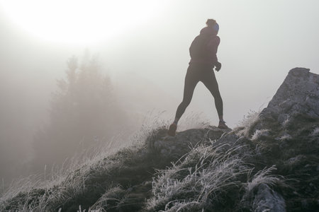 Trail Runner in Misty Mountain Landscapeの写真素材