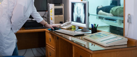 Radiologist Analyzing X-Ray Scans in a Medical Imaging Room.の写真素材