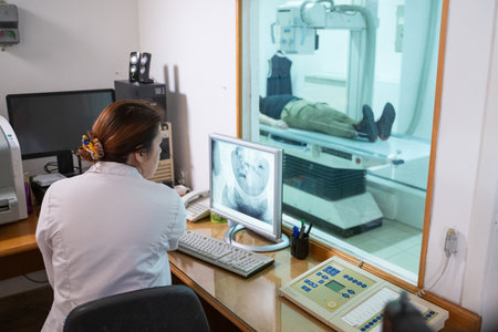Radiologist Analyzing X-Ray Scans in a Medical Imaging Room.の写真素材