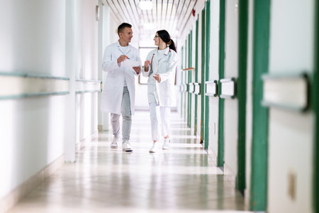 Doctors Walking in Hospital Hallwayの写真素材