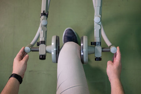 Leg Exercise on Rehabilitation Device.Top down view of a person using a rehabilitation machine for...