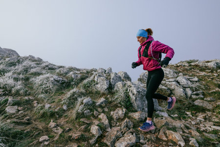 Trail Runner in Misty Mountain Landscape