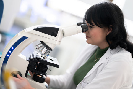 Doctor scientist using microscope in laboratory
