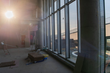 A captivating view of a modern business building under construction, showcasing its raw industrial...