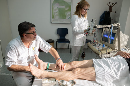 Doctors performing patient diagnostics with equipment