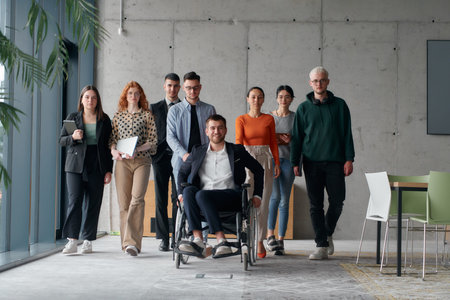 A diverse group of business professionals walking together through the office, symbolizing unity and...