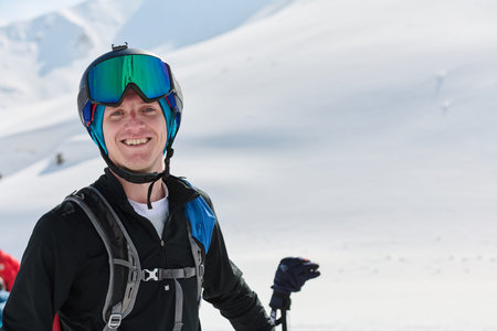 Portrait of a Professional Skiers Blissful Relaxation atop the Snowy Alps