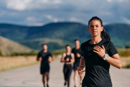 Leader Guiding Athletes on a Sunny Day Run