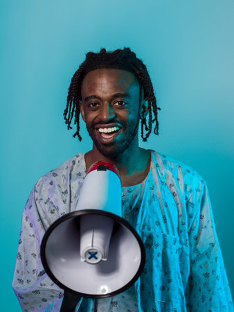 African American man dons traditional attire, passionately utilizing a megaphone against a striking...