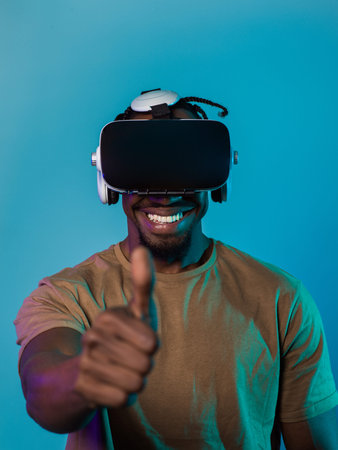 African American man wearing virtual reality glasses expresses satisfaction and impressed delight,...