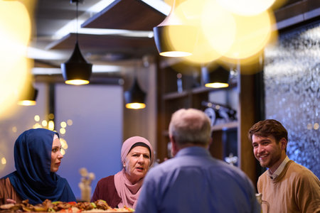 Family gathers for iftar while enjoying Ramadan traditions and sharing stories in a cozy settingの写真素材