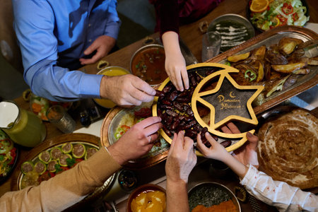 Families gather for iftar celebration during Ramadan with traditional dishes and shared moments of joy and connectionの写真素材
