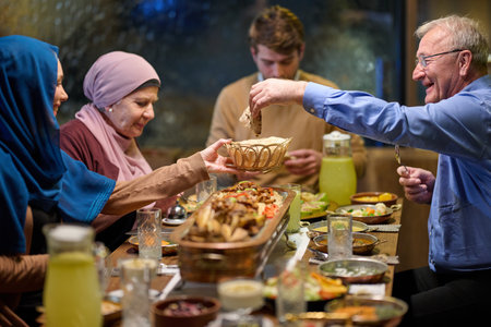 Muslim family enjoys iftar together at a restaurant during Ramadan with festive decorations and...